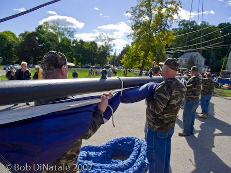 DPW workers assist with 45 ft x 90 ft American Flag